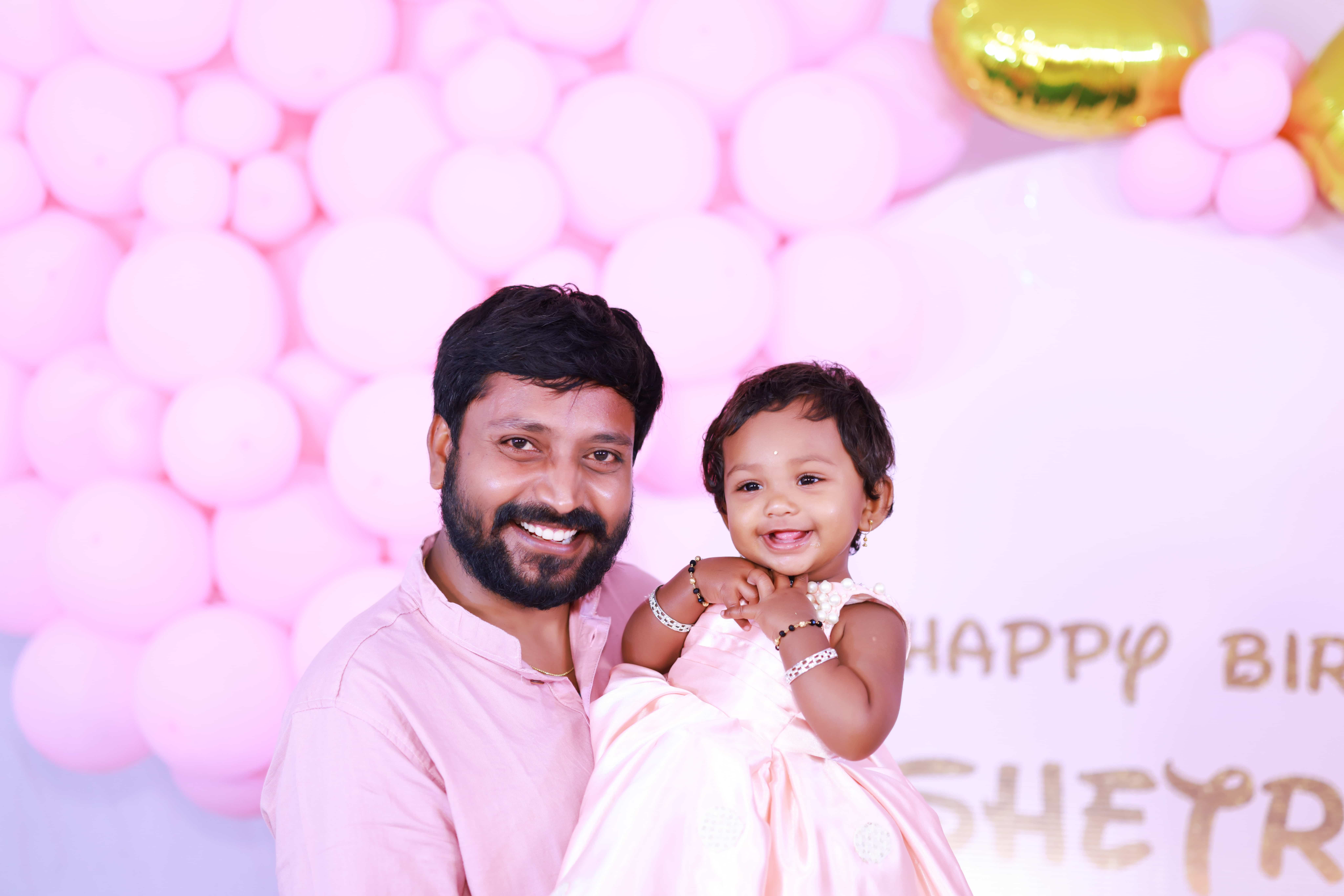 birthday father holding baby portrait Hyderabad first birthday photoshoot