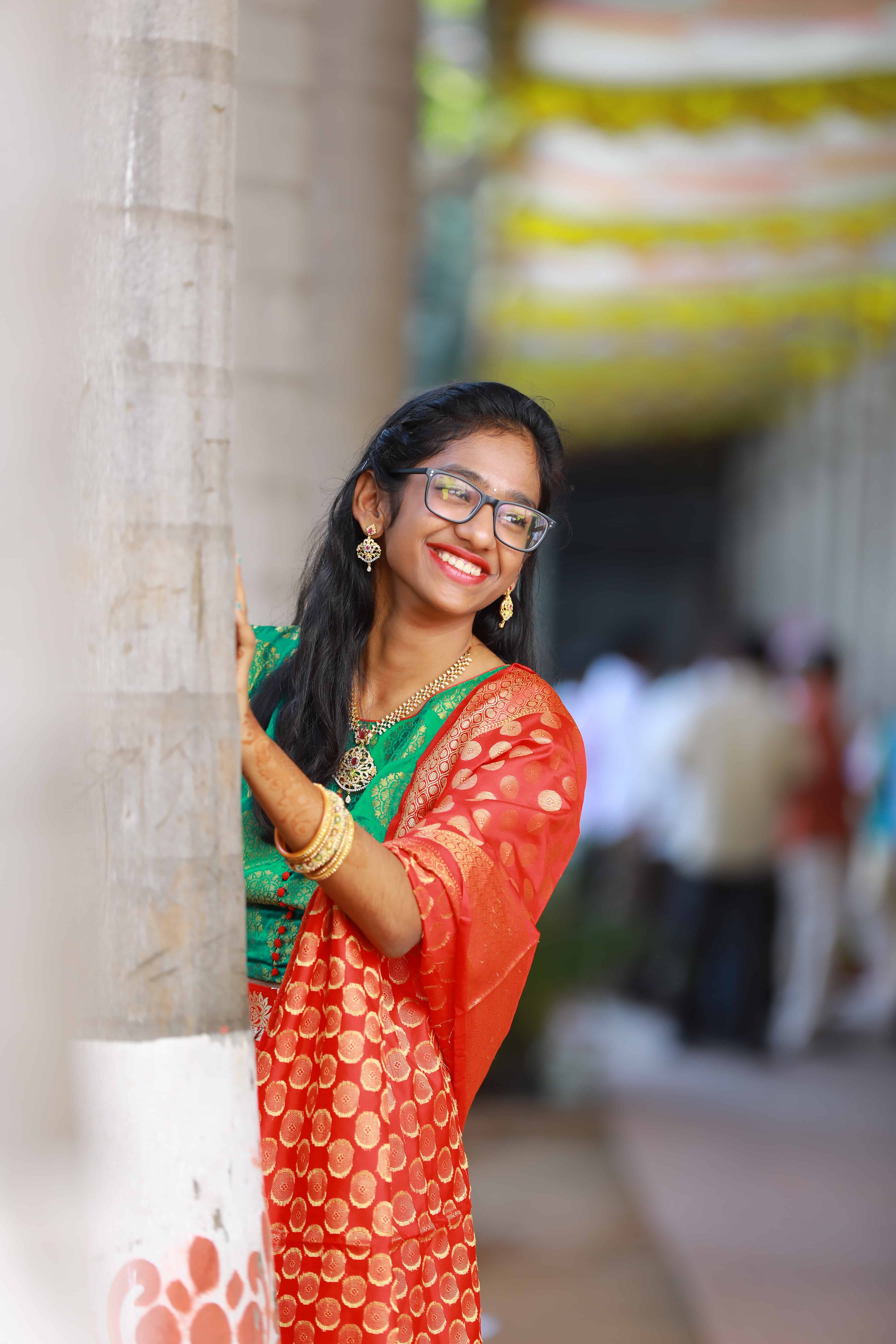 candid traditional portrait girl saree Hyderabad smiling natural pose outdoor photography