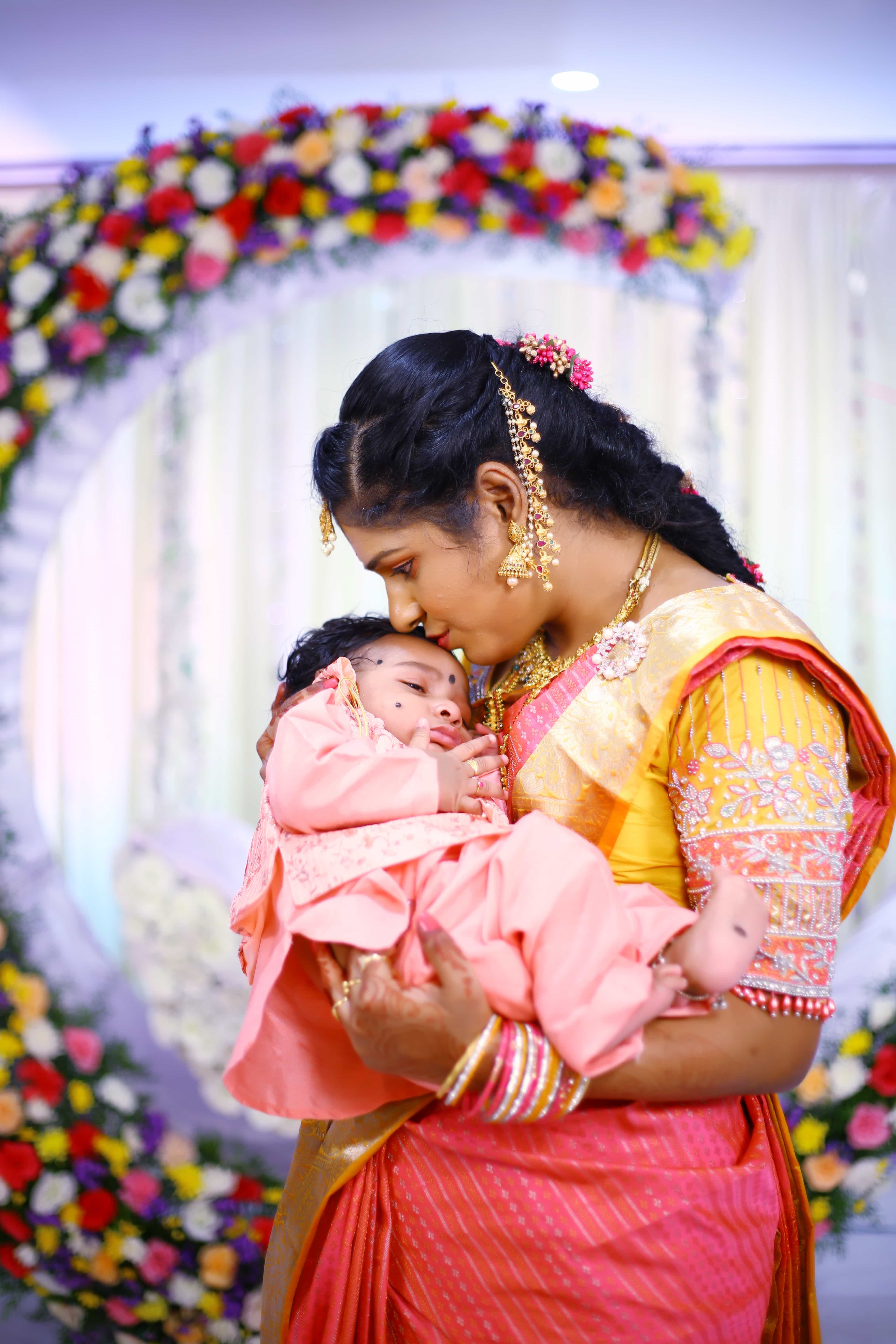 cradle ceremony mother holding baby Hyderabad traditional function
